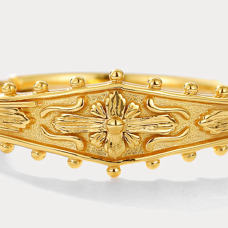 Elegant Grace: Embossed Brass Ring