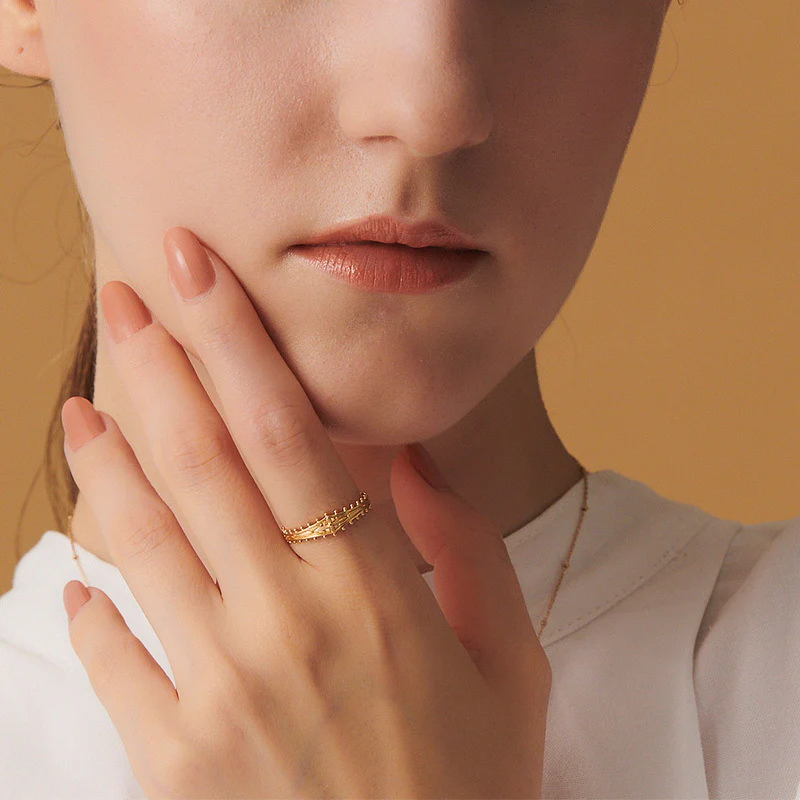 Elegant Grace: Embossed Brass Ring